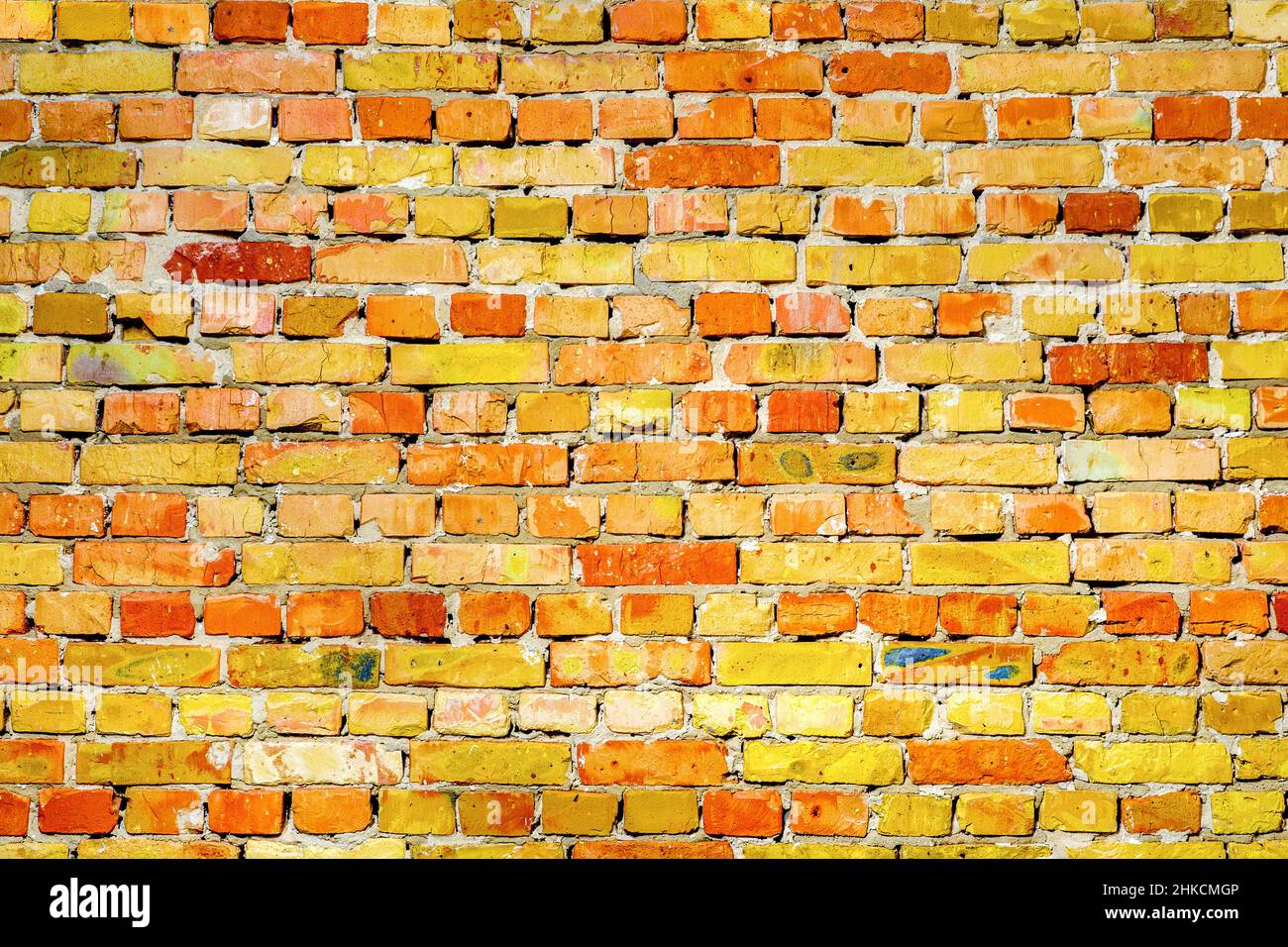 Vibrant brick wall texture pattern stone masonry background. Old brickwork texture. Backdrop texture masonry wall brick background. Old yellow brick Stock Photo