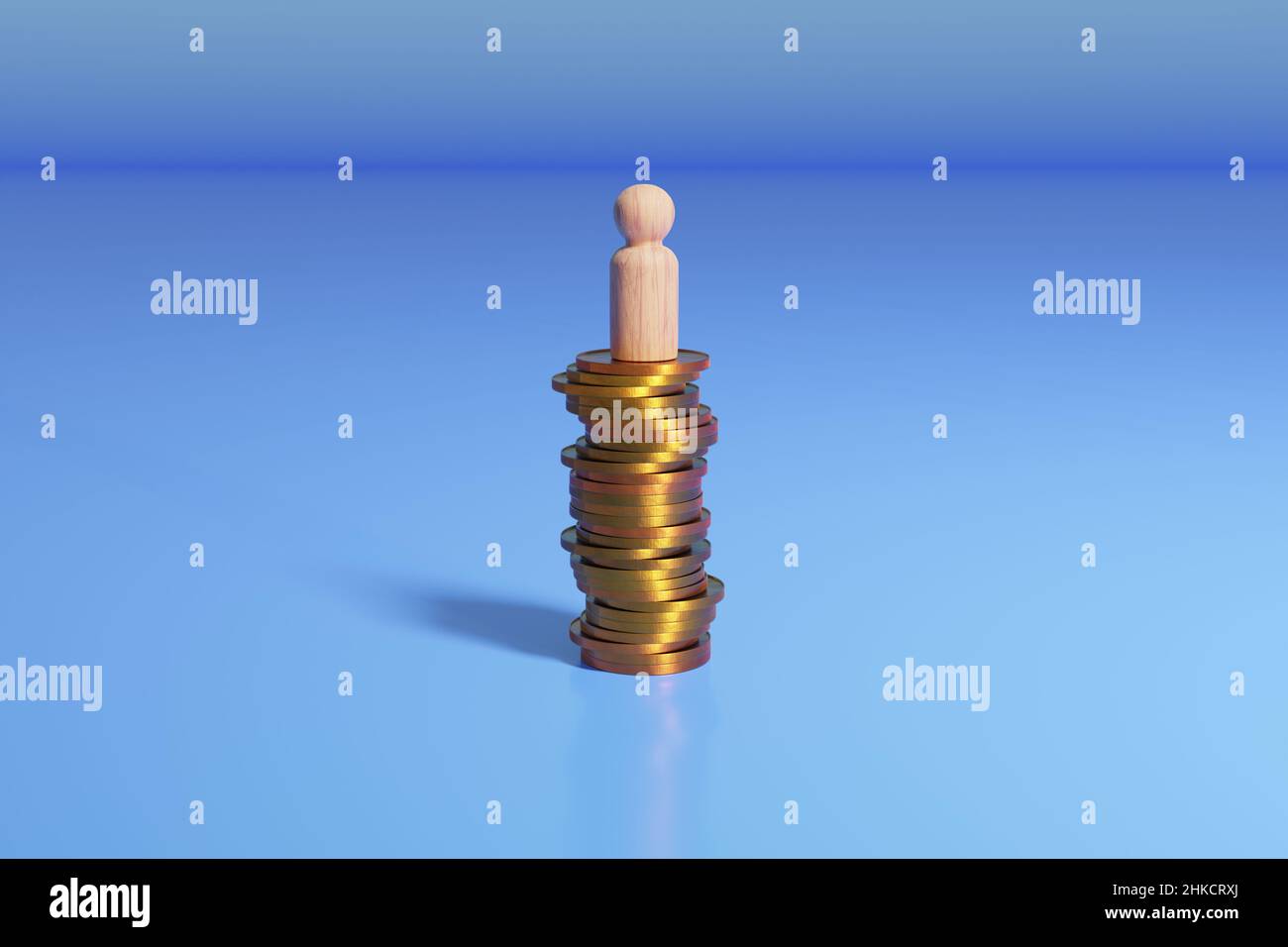 Wooden peg doll on stack of coins. Financial success concept. Stock Photo
