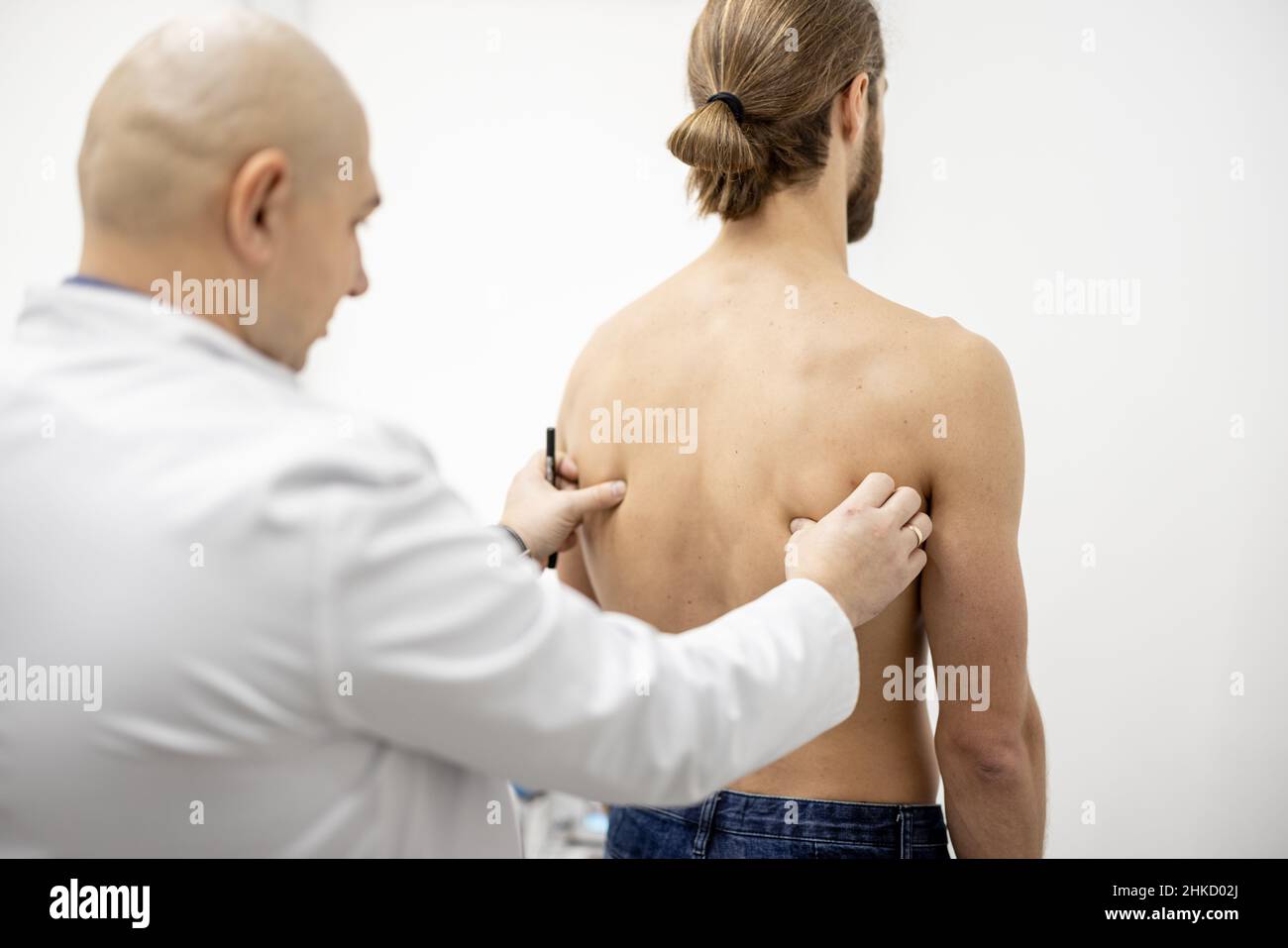 Man on examination by physical therapist Stock Photo
