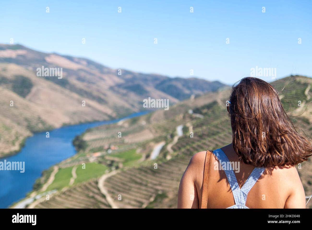 Woman enjoying the view of the Douro vineyards Stock Photo