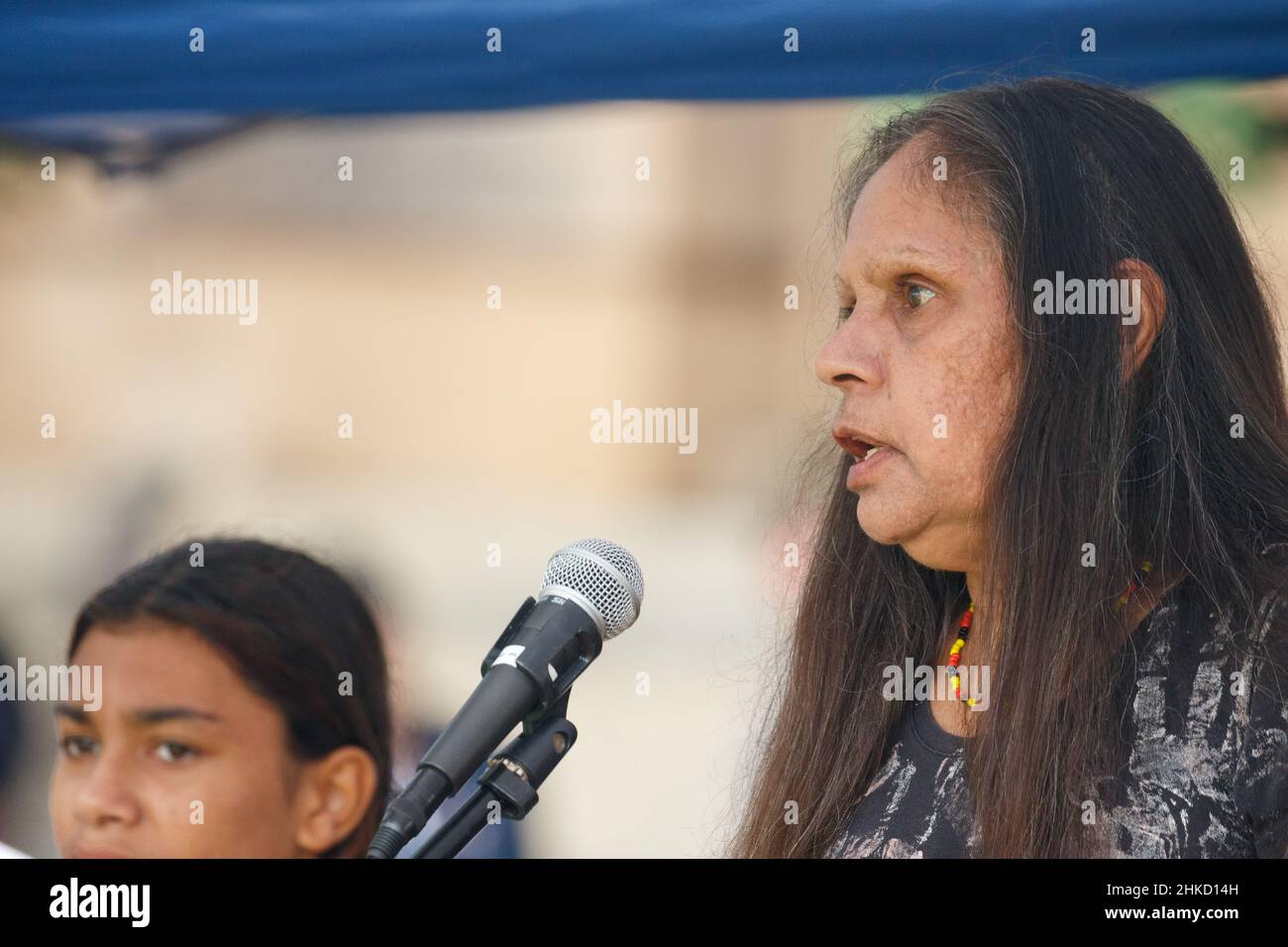 Aboriginal protester Deb Sandy speaks to the crowd during the rally at Queens Gardens.Protesters took to the streets of Brisbane, Queensland, Australia on the 26th January, the Australia Day (often referred to as Invasion Day): a date synonymous with the beginning of the persecution of Aboriginal people to call for action on important issues for First Nations people and for proper recognition of crimes historically perpetrated against them. Several elders spoke at Queens Gardens before the crowd marched through the city and over the bridge to Musgrave Park in South Brisbane. (Photo by Joshua P Stock Photo
