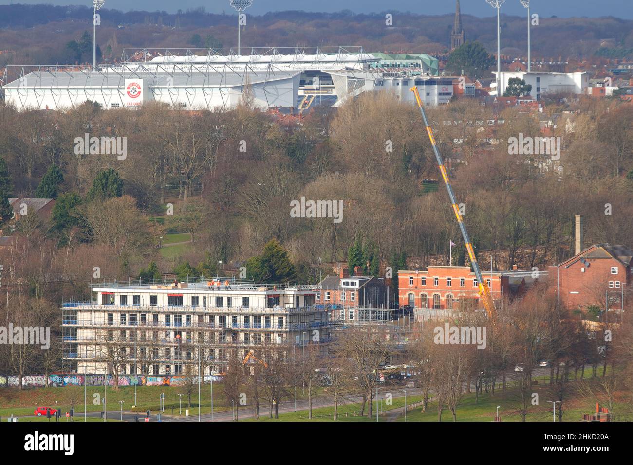 Alexandra Park apartments under construction on Willow Road in Leeds. Headingley Stadium can be seen in the background. Stock Photo