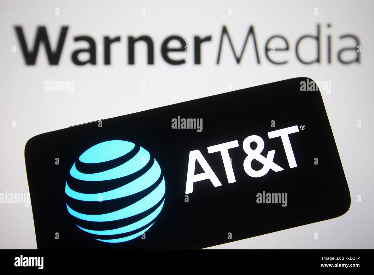 In this photo illustration, an AT&T Inc. logo is seen on a smartphone ...