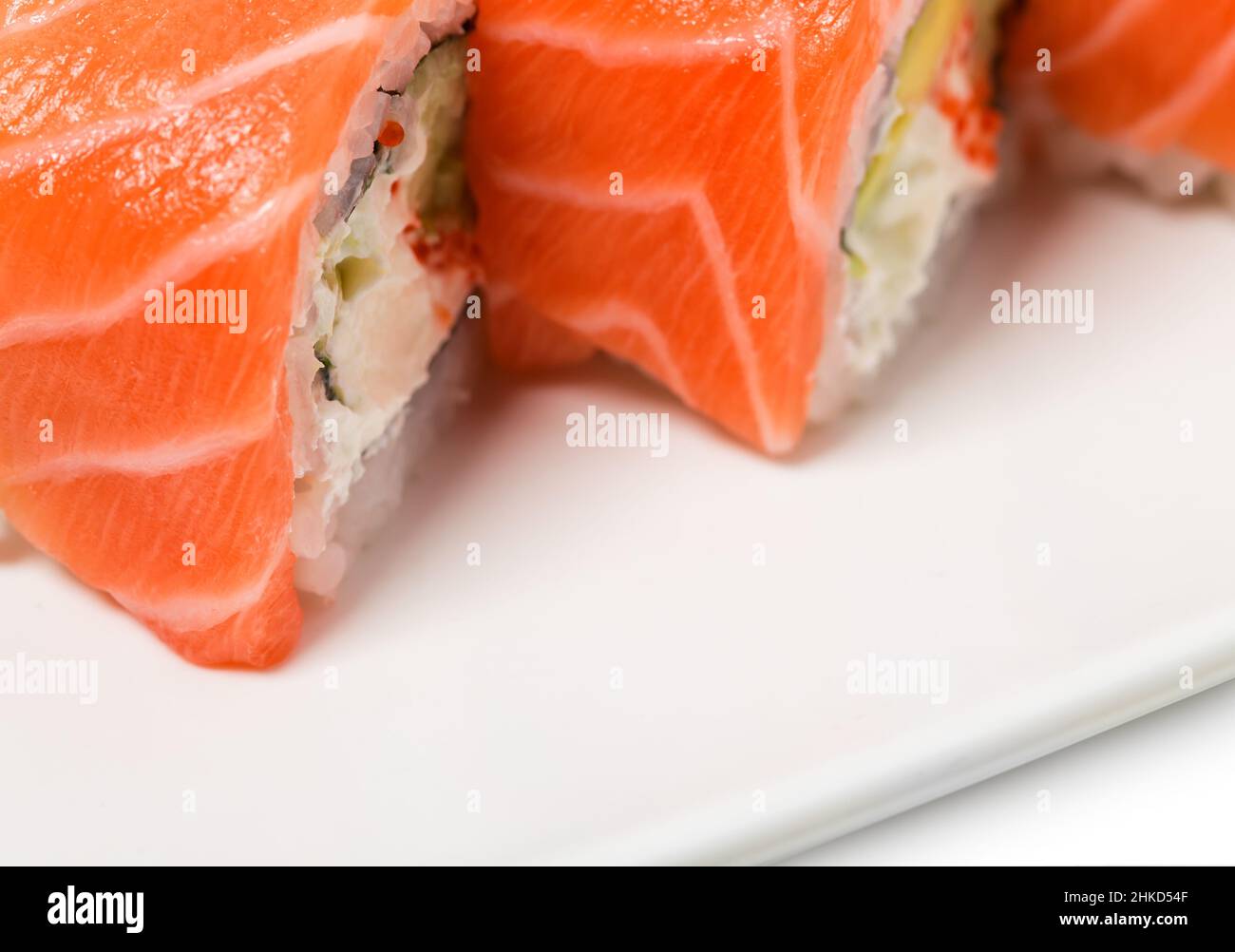 Uramaki salmon roll with scallops. Can be used as a background. Stock Photo