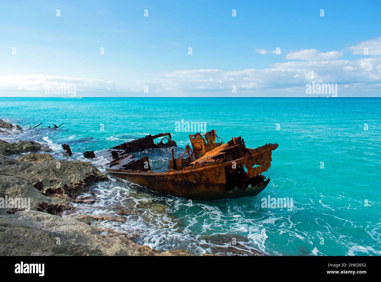 The deteriorating Gallant Lady shipwreck on the rocky coastline of North Bimini, Bahamas, in the blue Atlantic ocean. Stock Photo