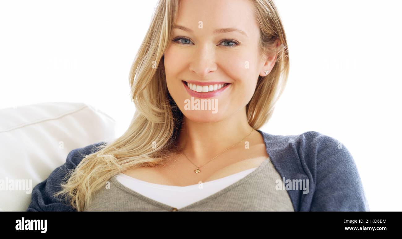 She glows with happiness. Cropped portrait of an attractive young woman at home. Stock Photo