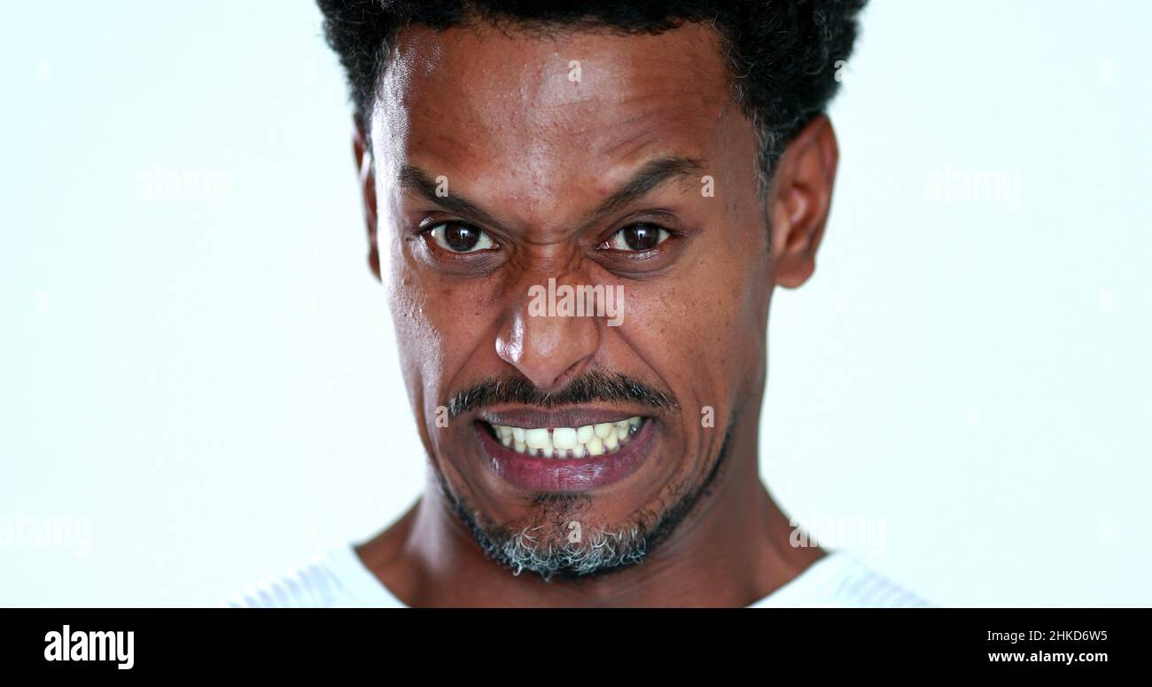 Face emotion expression reaction with disgust and dislike, african man feeling revulsion Stock Photo