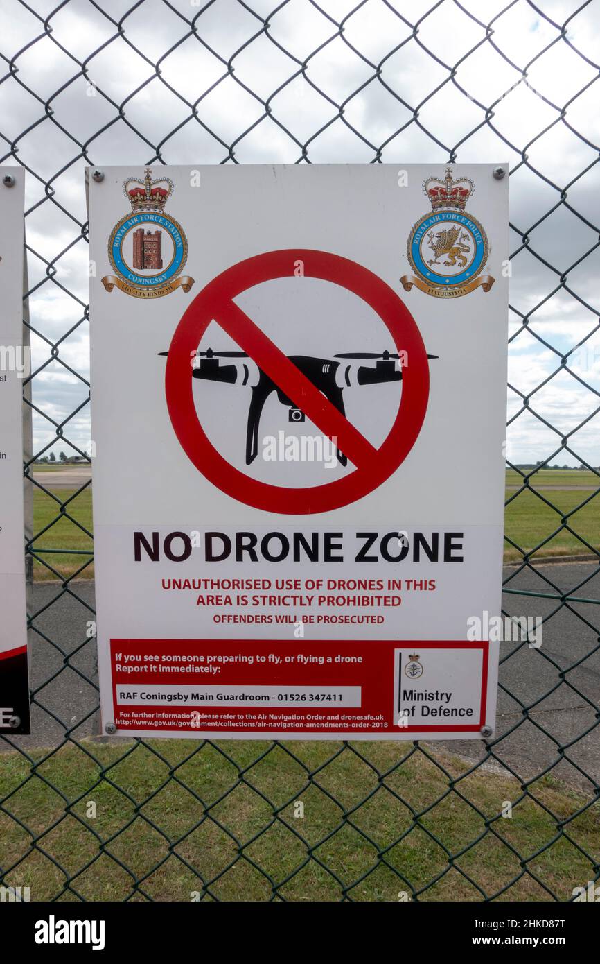 'No Drone Zone' warning sign on drone flying on the fence of RAF Coningsby, near Coningsby, Lincolnshire, England. Stock Photo