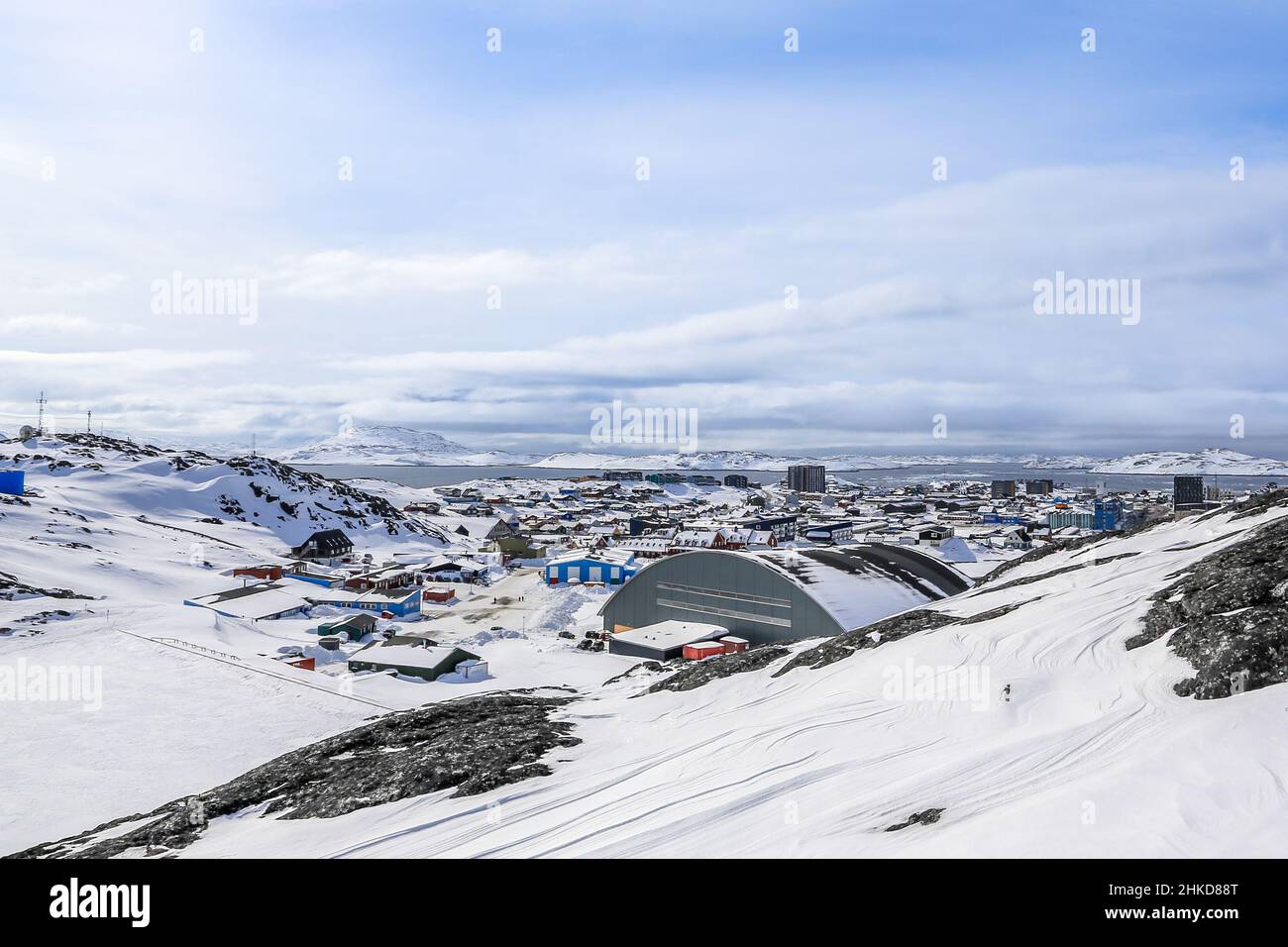 Nuuk city covered in snow with sea and mountains in the background, Greenland Stock Photo