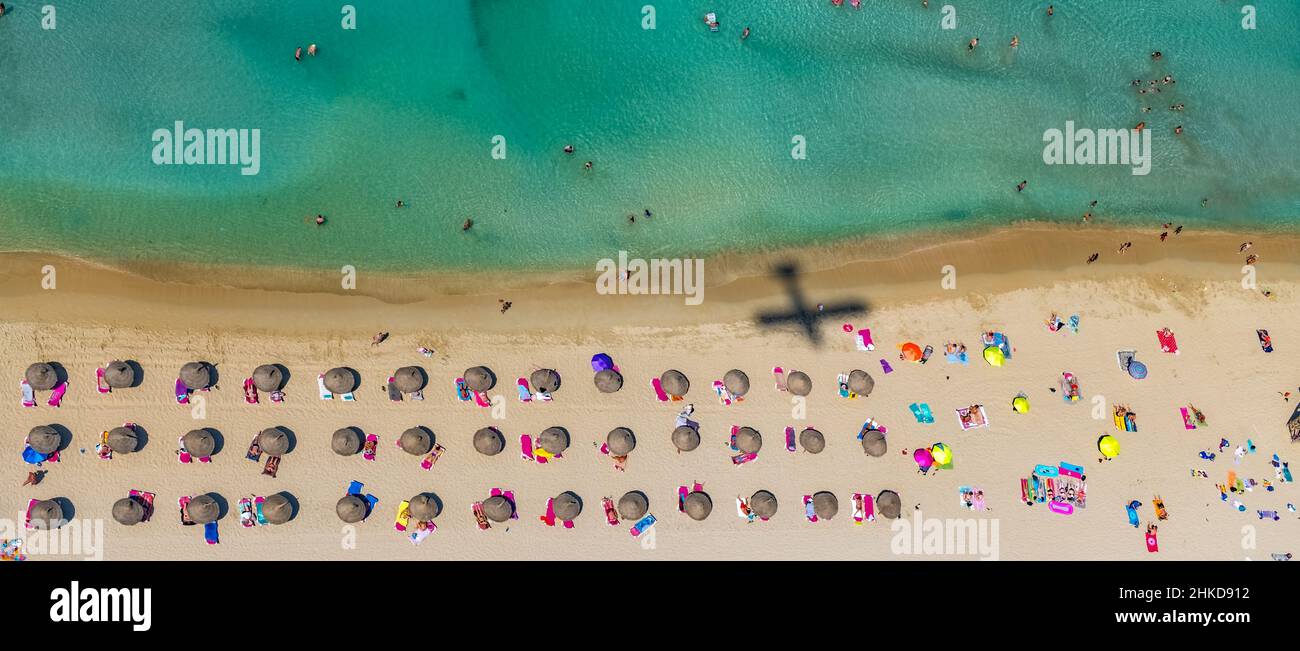 Aerial view, beach life with straw parasols and shadow of an aeroplane, Las Maravillas, Palma, Mallorca, Balearic Islands, Spain, bathers, ES, recepti Stock Photo