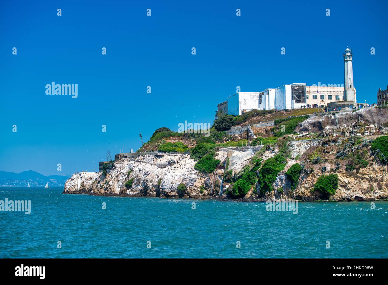 Alcatraz Island and Prison, view from the ocean on a clear sunny day Stock Photo