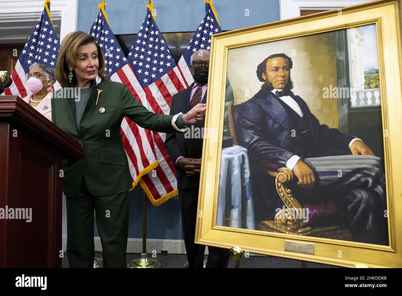Washington, United States. 03rd Feb, 2022. United States Speaker of the House Nancy Pelosi gestures beside a portrait of Joseph H. Rainey, as Democratic Representative from South Carolina James Clyburn (Back) look on during an unveiling ceremony for the Joseph H. Rainey Room, on Capitol Hill in Washington, DC, USA, 03 February 2022. Rainey was the first black person to serve in the United States House of Representatives. Pool Photo by Michael Reynolds/UPI Credit: UPI/Alamy Live News Stock Photo
