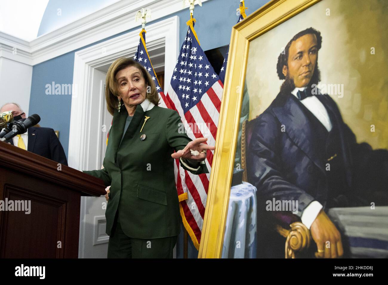 Washington, United States. 03rd Feb, 2022. United States Speaker of the House Nancy Pelosi gestures beside a portrait of Joseph H. Rainey, during an unveiling ceremony for the Joseph H. Rainey Room, on Capitol Hill in Washington, DC, on Thursday, February 3, 2022. Rainey was the first black person to serve in the United States House of Representatives. Pool Photo by Michael Reynolds/UPI Credit: UPI/Alamy Live News Stock Photo