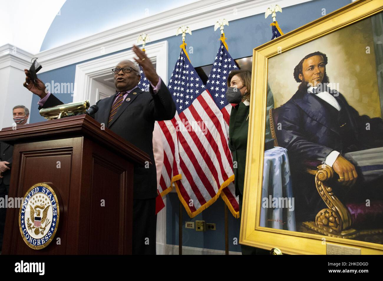 Washington, United States. 03rd Feb, 2022. United States Speaker of the House Nancy Pelosi (R) stands beside a portrait of Joseph H. Rainey, as Democratic Representative from South Carolina James Clyburn (L) speaks during an unveiling ceremony for the Joseph H. Rainey Room, on Capitol Hill in Washington, DC, on Thursday, February 3, 2022. Rainey was the first Black person to serve in the United States House of Representatives. Pool Photo by Michael Reynolds/UPI Credit: UPI/Alamy Live News Stock Photo