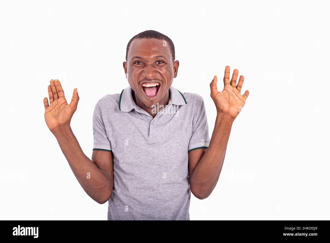 Portrait of a man sweeping his arms with open palms shrugging, smiling