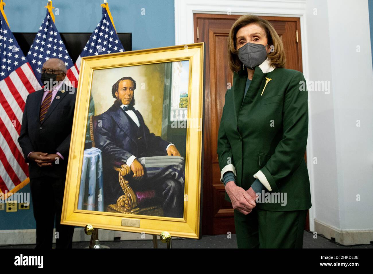 Washington, USA. 03rd Feb, 2022. United States Speaker of the House Nancy Pelosi (R) stands beside a portrait of Joseph H. Rainey, as Democratic Representative from South Carolina James Clyburn (Back) look on during an unveiling ceremony for the Joseph H. Rainey Room, on Capitol Hill in Washington, DC, USA, 03 February 2022. Rainey was the first black person to serve in the United States House of Representatives. (Photo by Pool/Sipa USA) Credit: Sipa USA/Alamy Live News Stock Photo