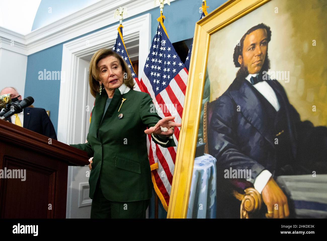 Washington, USA. 03rd Feb, 2022. United States Speaker of the House Nancy Pelosi gestures beside a portrait of Joseph H. Rainey, during an unveiling ceremony for the Joseph H. Rainey Room, on Capitol Hill in Washington, DC, USA, 03 February 2022. Rainey was the first black person to serve in the United States House of Representatives. (Photo by Pool/Sipa USA) Credit: Sipa USA/Alamy Live News Stock Photo