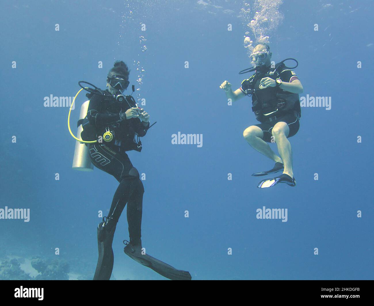 Scuba divers underwater Stock Photo