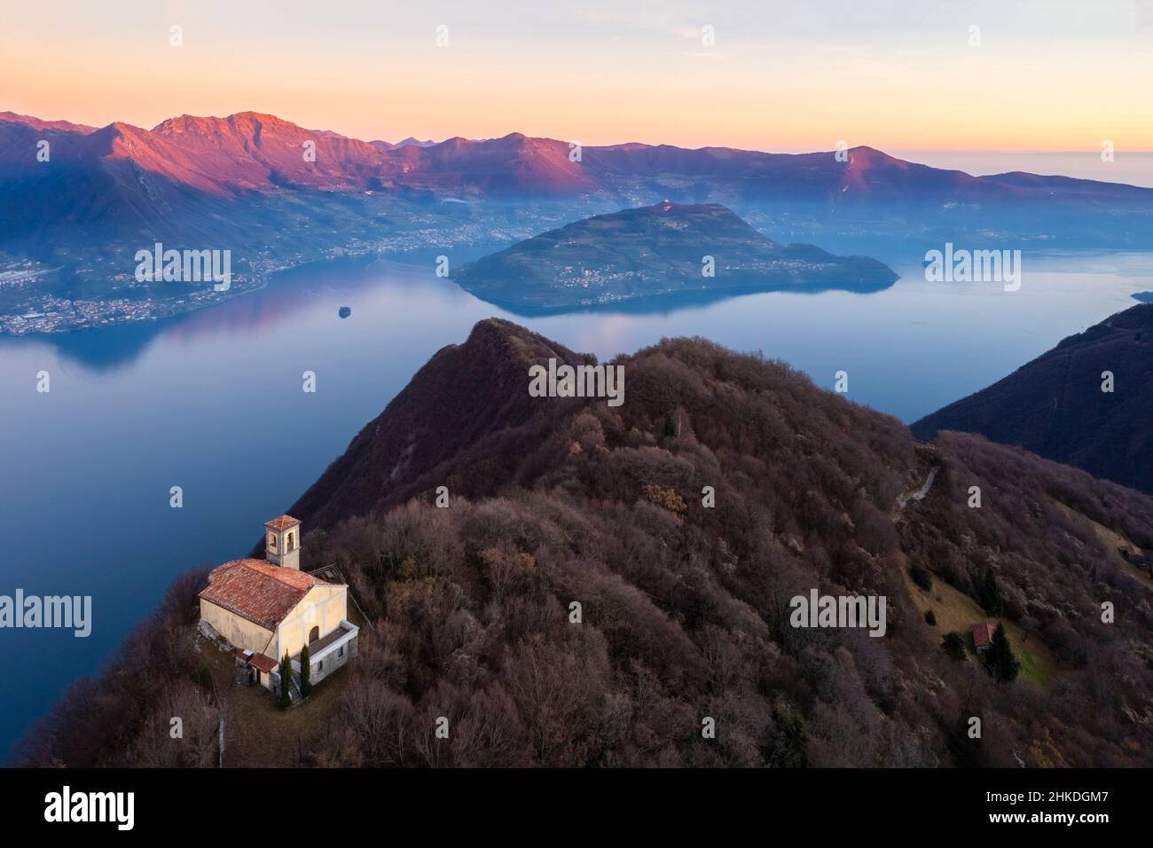 Aerial view of the Santuario della Santissima on Lake Iseo at sunset. Parzanica, Iseo Lake, Bergamo district, Lombardy, Italy. Stock Photo