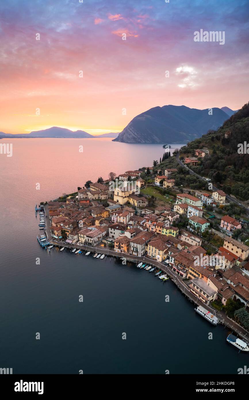 Aerial view of Monte Isola and Peschiera Maraglio village at sunset on