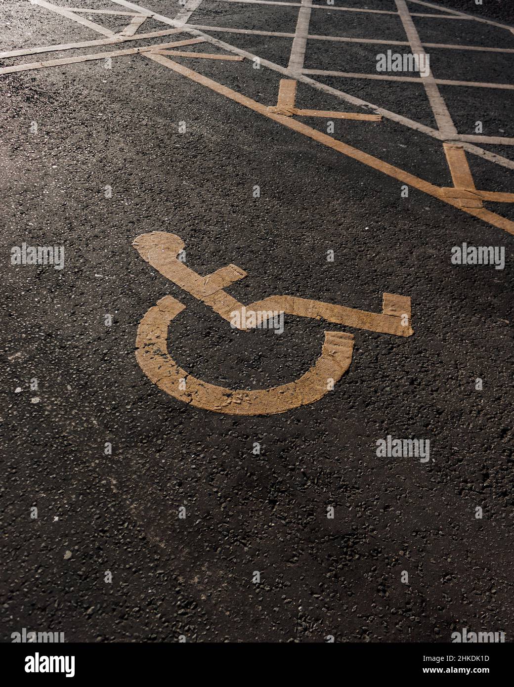 Disabled parking. Accessible parking spot. Blue badge. Yellow