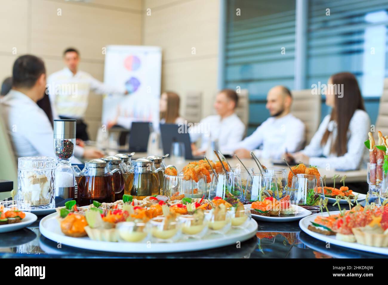 Catering in the office. A table with canapes and various snacks served