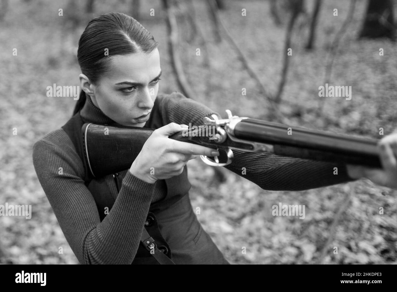 hunter carry rifle. Target shot. female hunter in forest. woman with weapon. successful hunt. hunting sport. girl with rifle. chase hunting. Gun shop Stock Photo