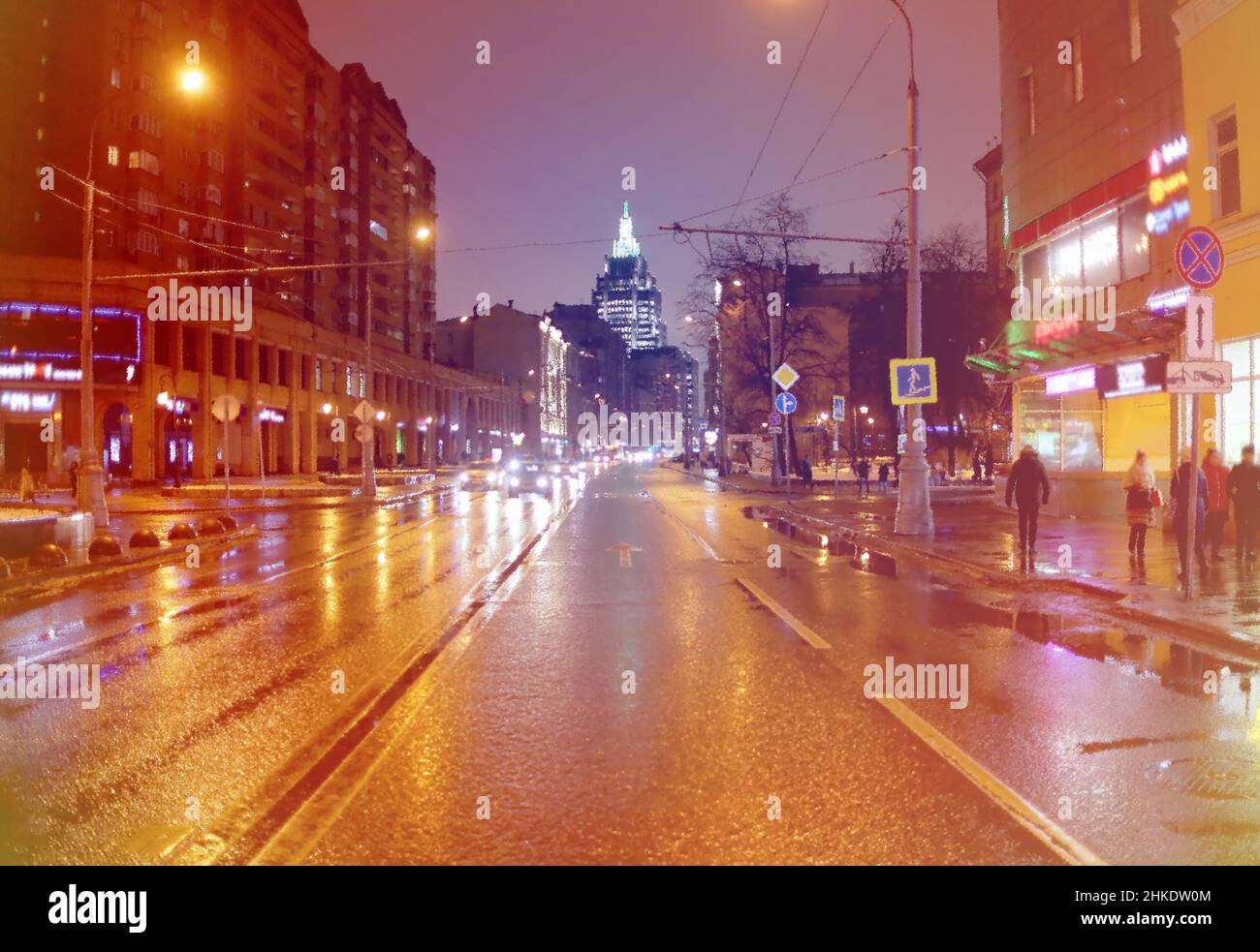 Beautiful photo of evening Moscow cars are driving down the street and people are walking Stock Photo