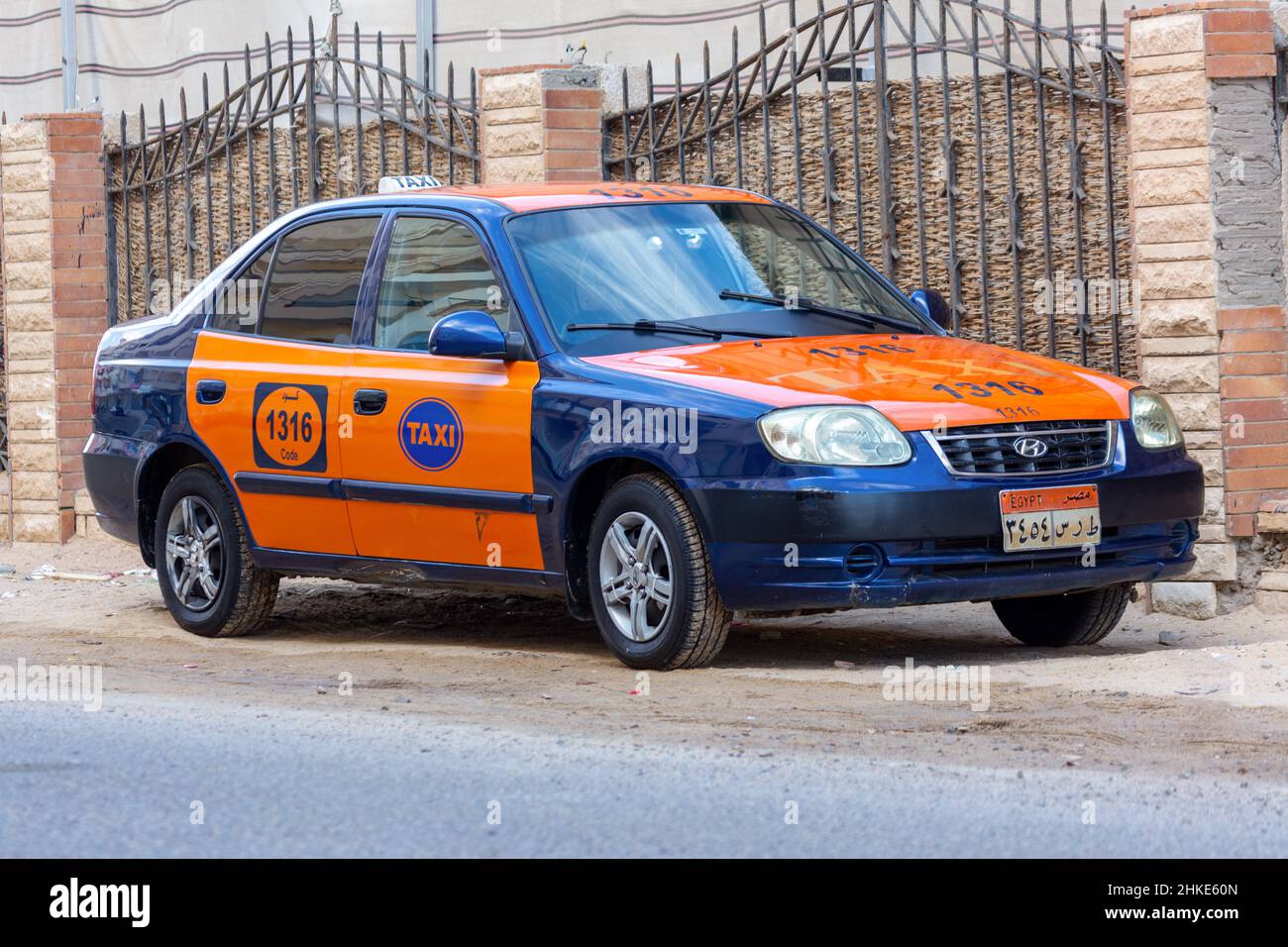 Hurghada, Egypt - January 30, 2022: Taxi cab stands on a street in Hurghada, Egypt. Stock Photo