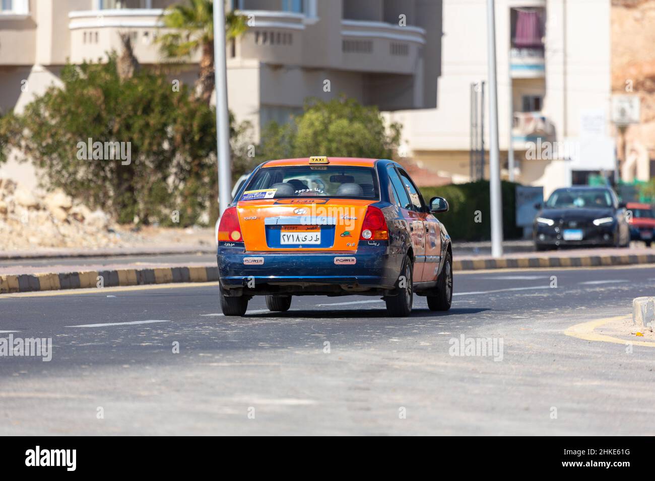 Hurghada, Egypt - January 30, 2022: Taxi cab drives on a street in Hurghada, Egypt. Stock Photo