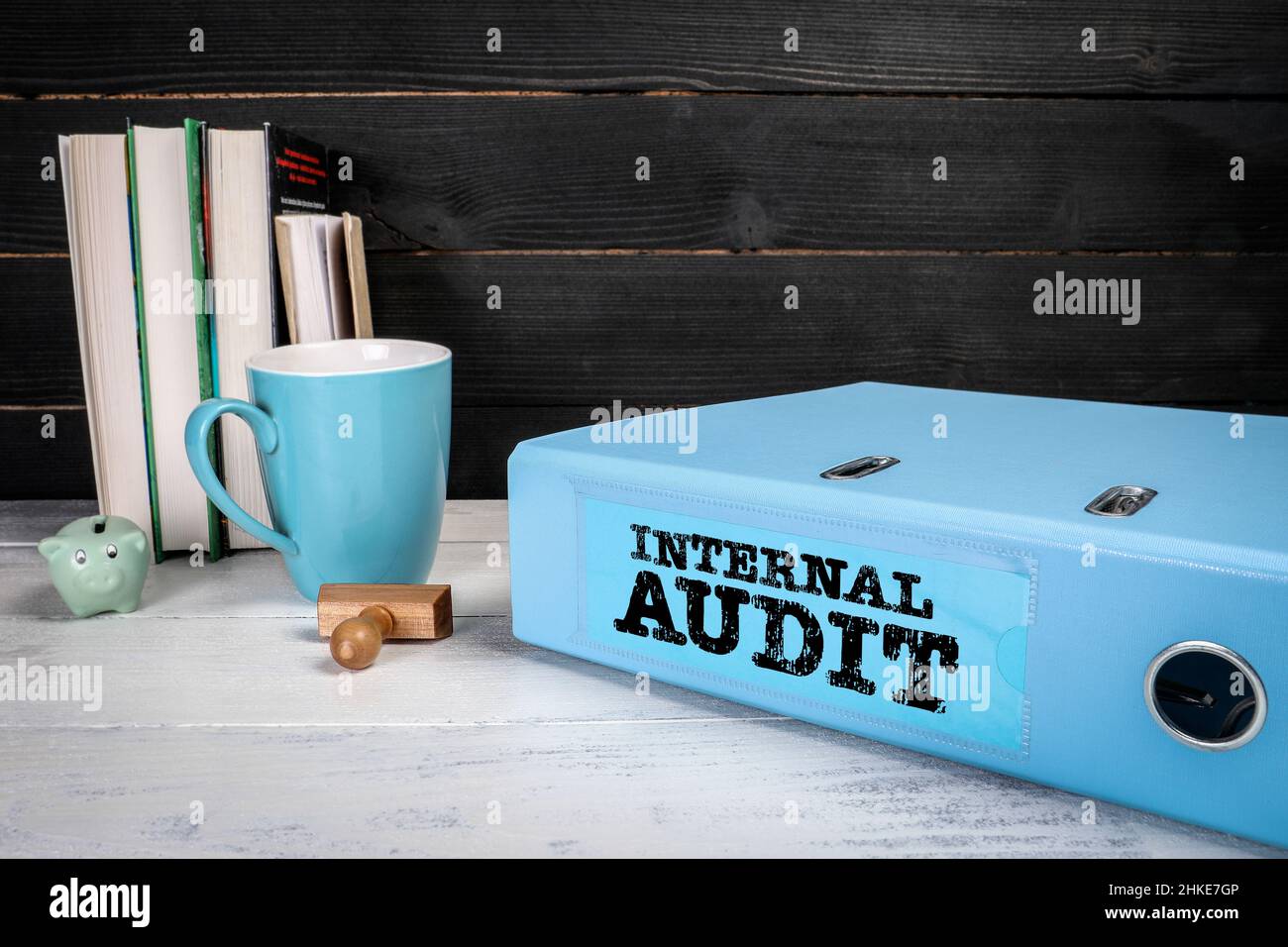 Internal Audit. Blue office document binder on a wooden table. Stock Photo