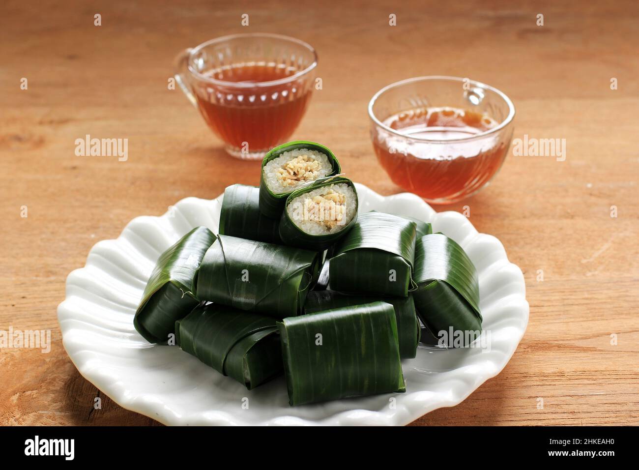 Lemper is Indonesian Traditional Dish Made from Glutinous or Sticky Rice, Steamed with Coconut Milk, with Chicken Floss Inside and Wrapped with Banana Stock Photo
