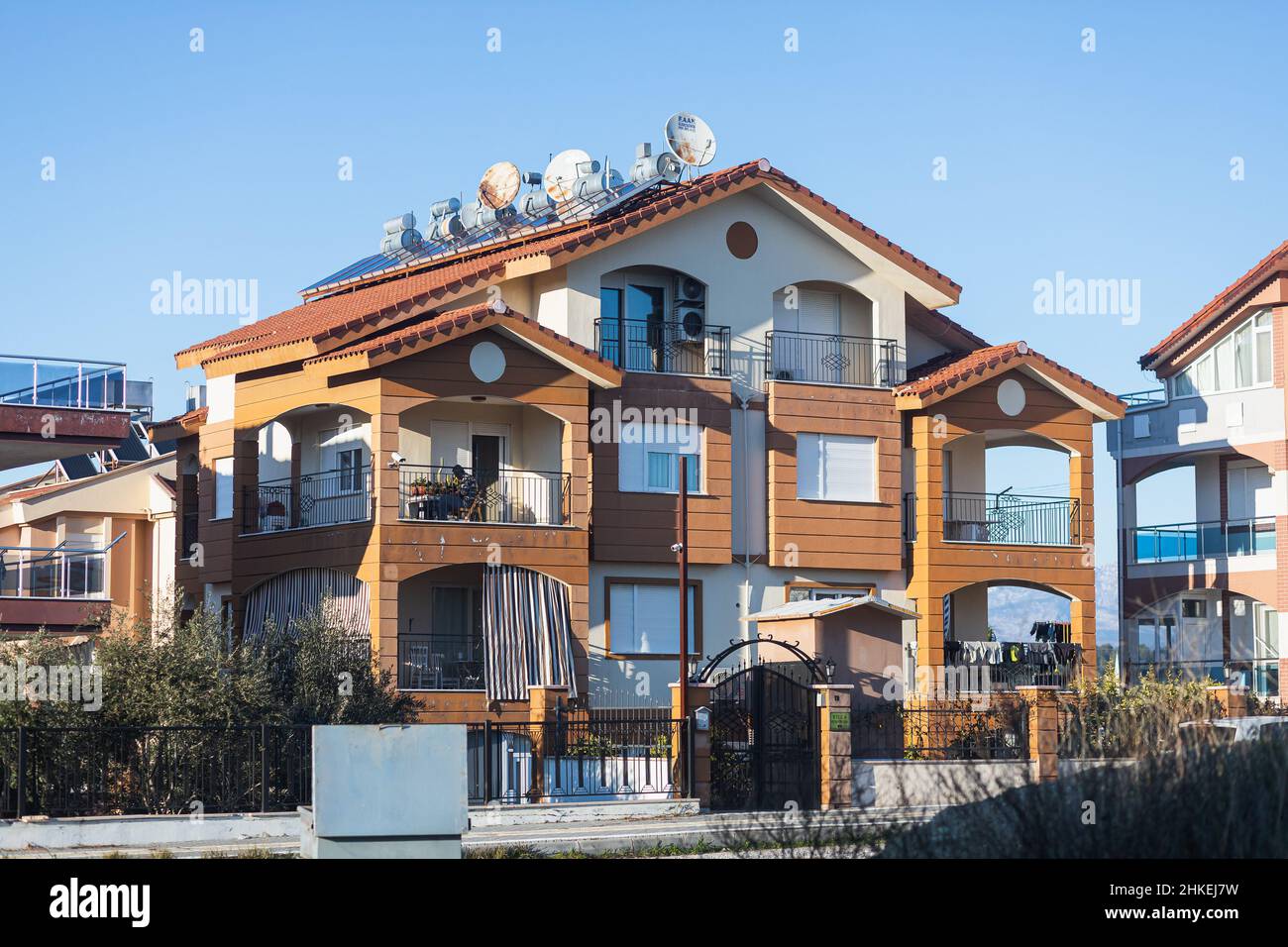 Colorful Turkish house with barrels of hot water on the roof and solar ...