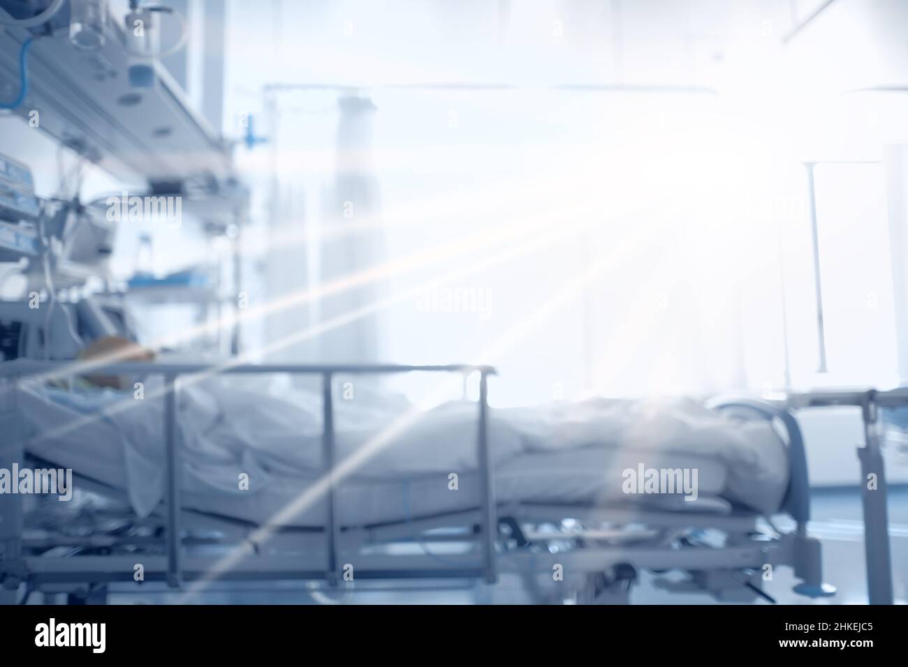 Flash of light illuminating a patient in intensive care, concept of patient emerging from coma. Stock Photo