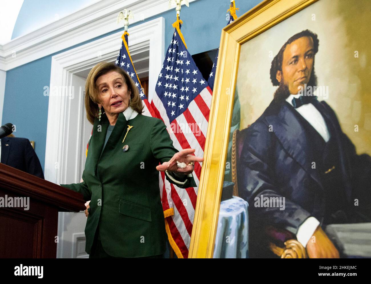 United States Speaker of the House Nancy Pelosi gestures beside a portrait of Joseph H. Rainey, during an unveiling ceremony for the Joseph H. Rainey Room, on Capitol Hill in Washington, DC, USA, February 3, 2022. Rainey was the first black person to serve in the United States House of Representatives. Photo by Michael Reynolds/Pool/ABACAPRESS.COM Stock Photo