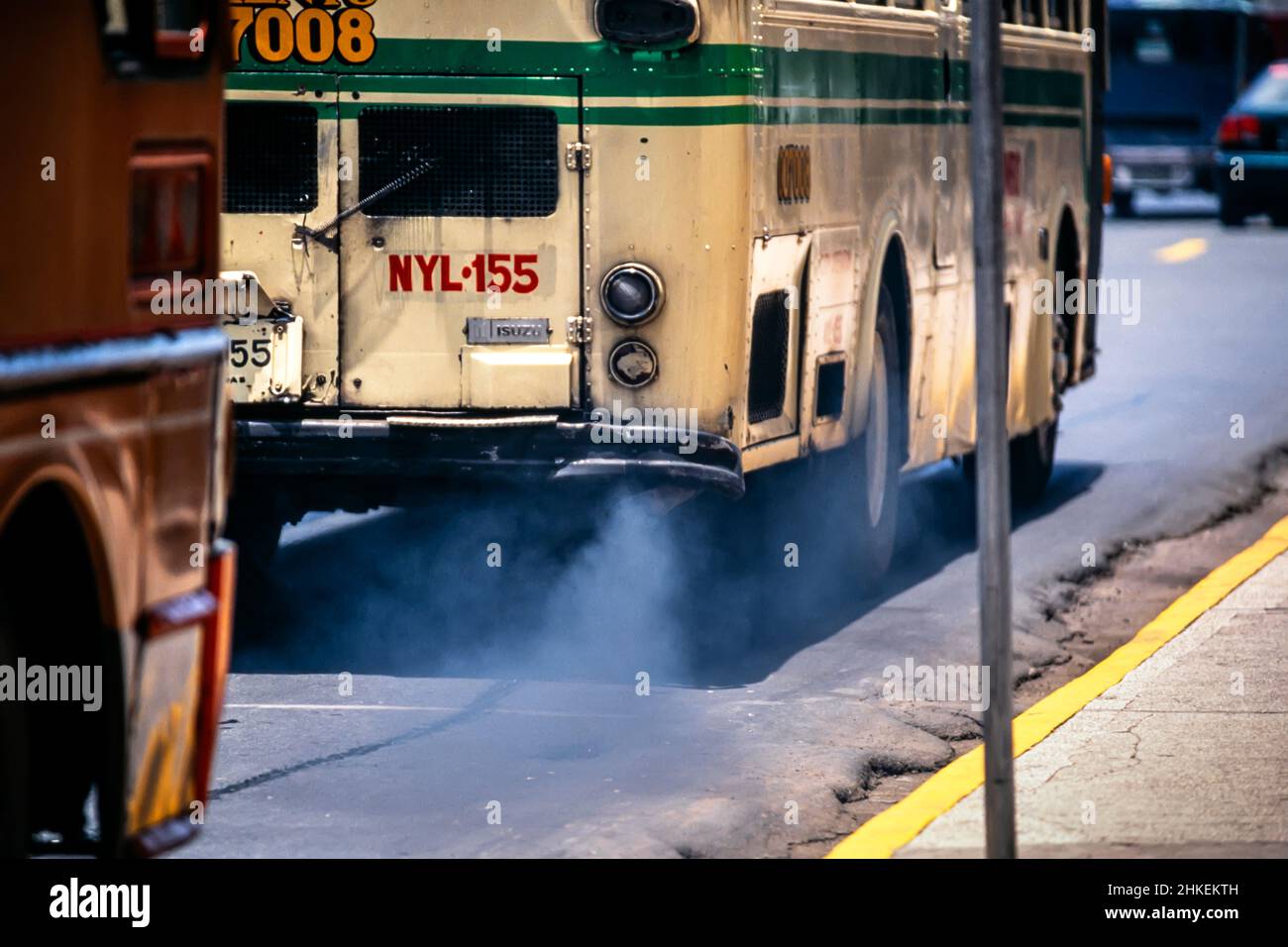 Exhaust smoke and fumes from bus in traffic on road in Manila, Philippines Stock Photo