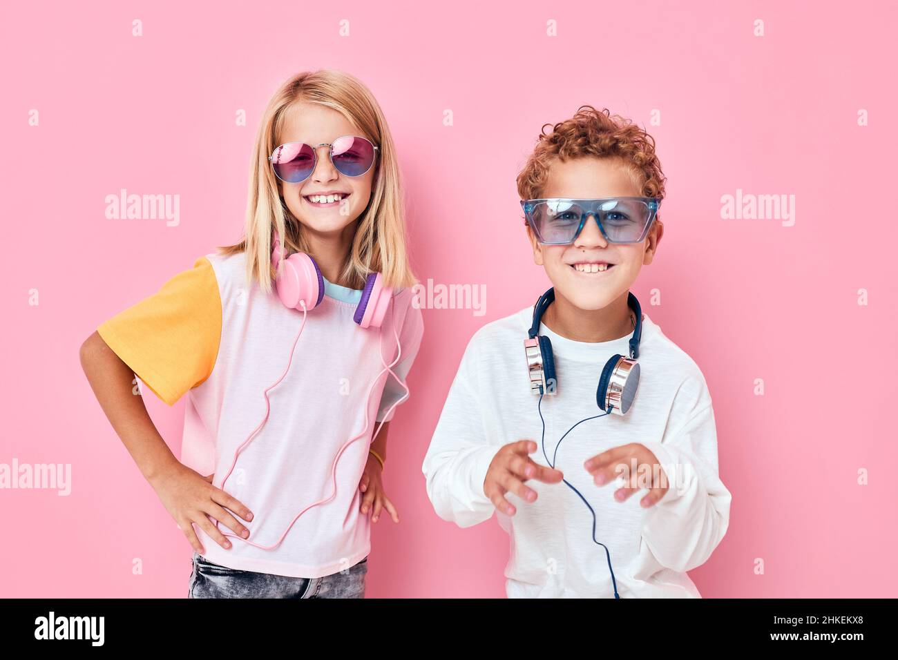 cute smiling kids in sunglasses have fun with friends Listening music