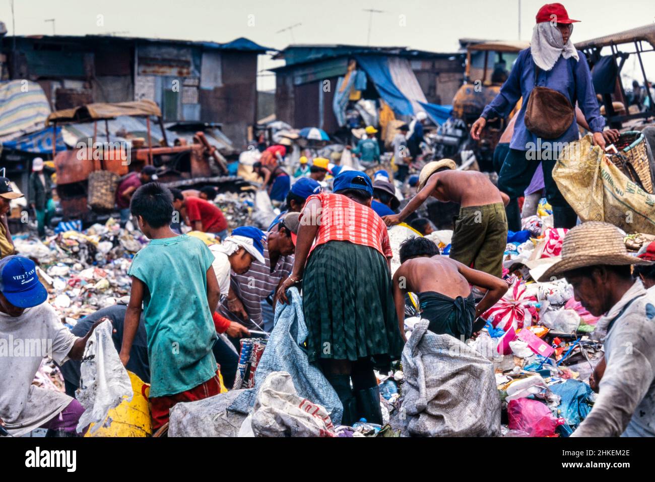 Scavengers on rubbish tip in Tondo, Manila, Philippines. People living among the garbage, and recycling what they can. Stock Photo