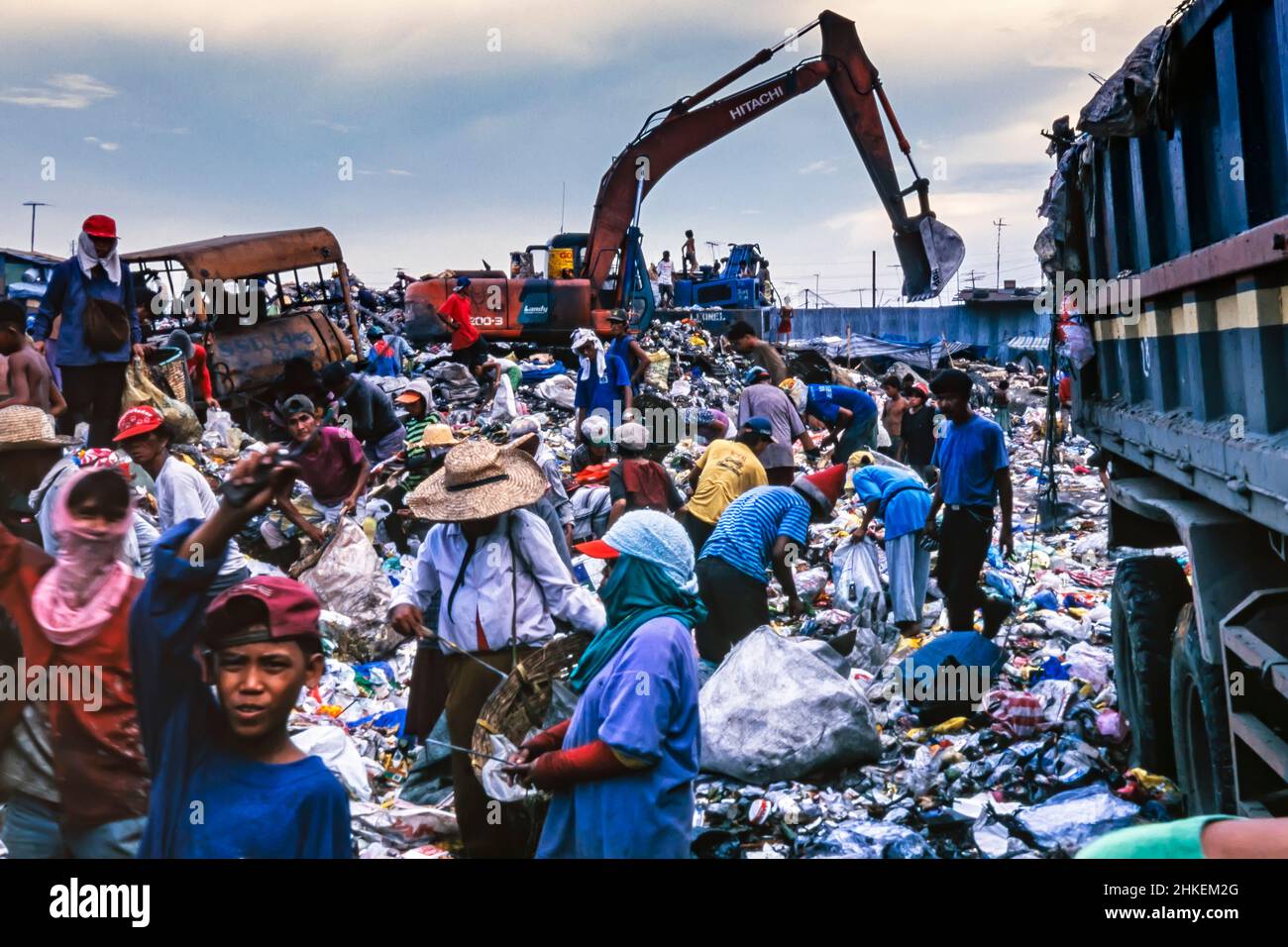 Scavengers on rubbish tip in Tondo, Manila, Philippines. People living among the garbage, and recycling what they can. Stock Photo