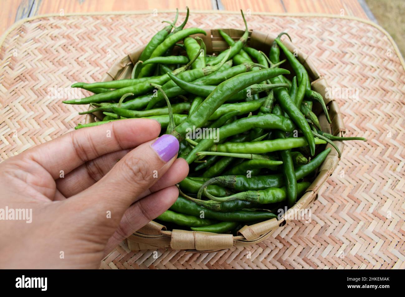 Woman selling chillies hi-res stock photography and images - Alamy