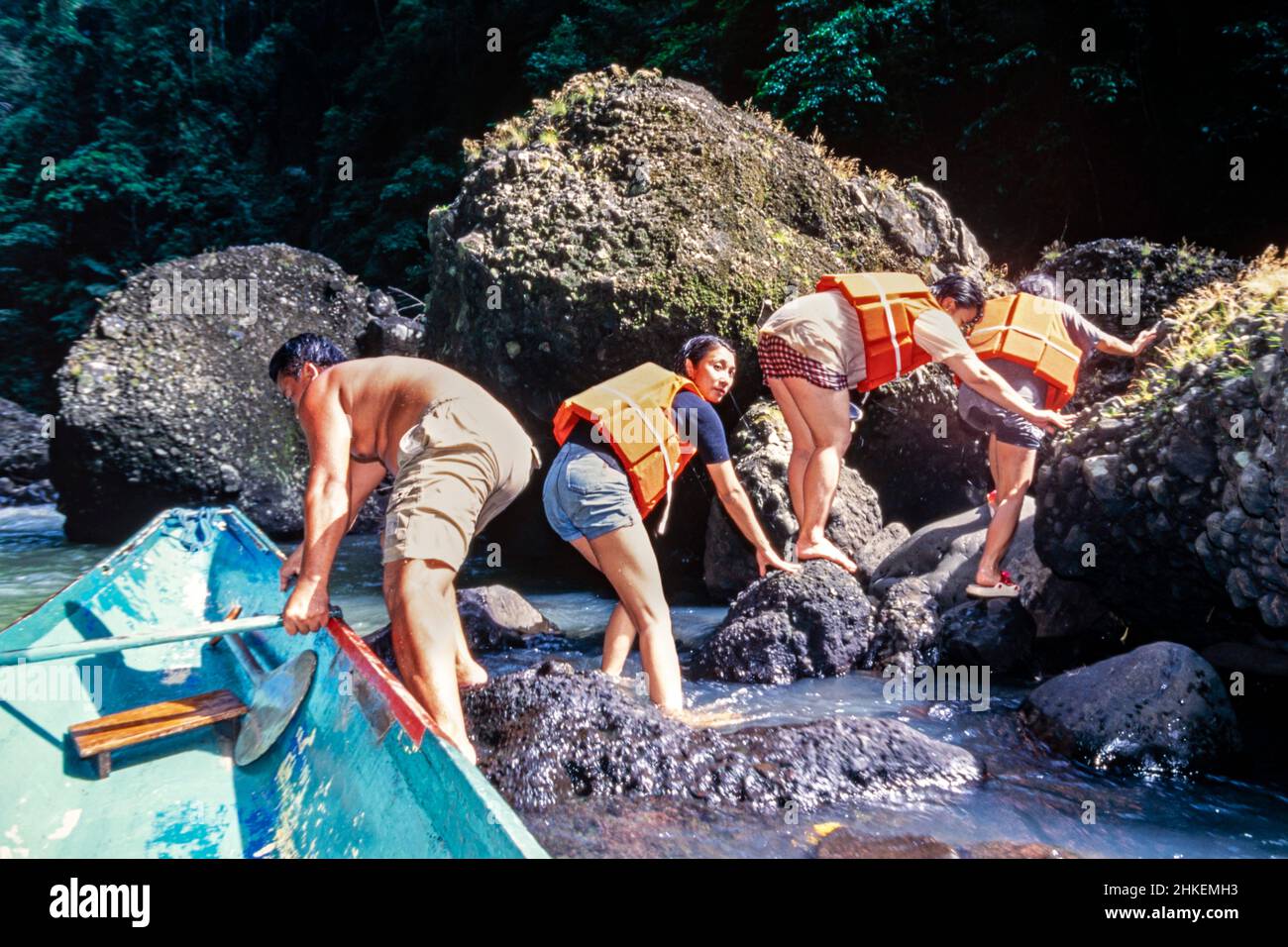 Boatman and tourists negotiating rocks and rapids on Pagsanjan river, Laguna, Philippines Stock Photo