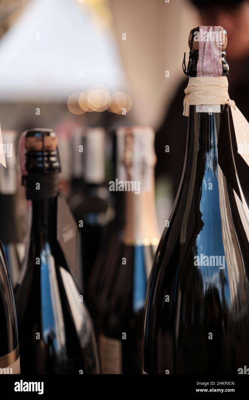 A closeup shot of bottles display at exhibitor stand at food and wine fair. Stock Photo