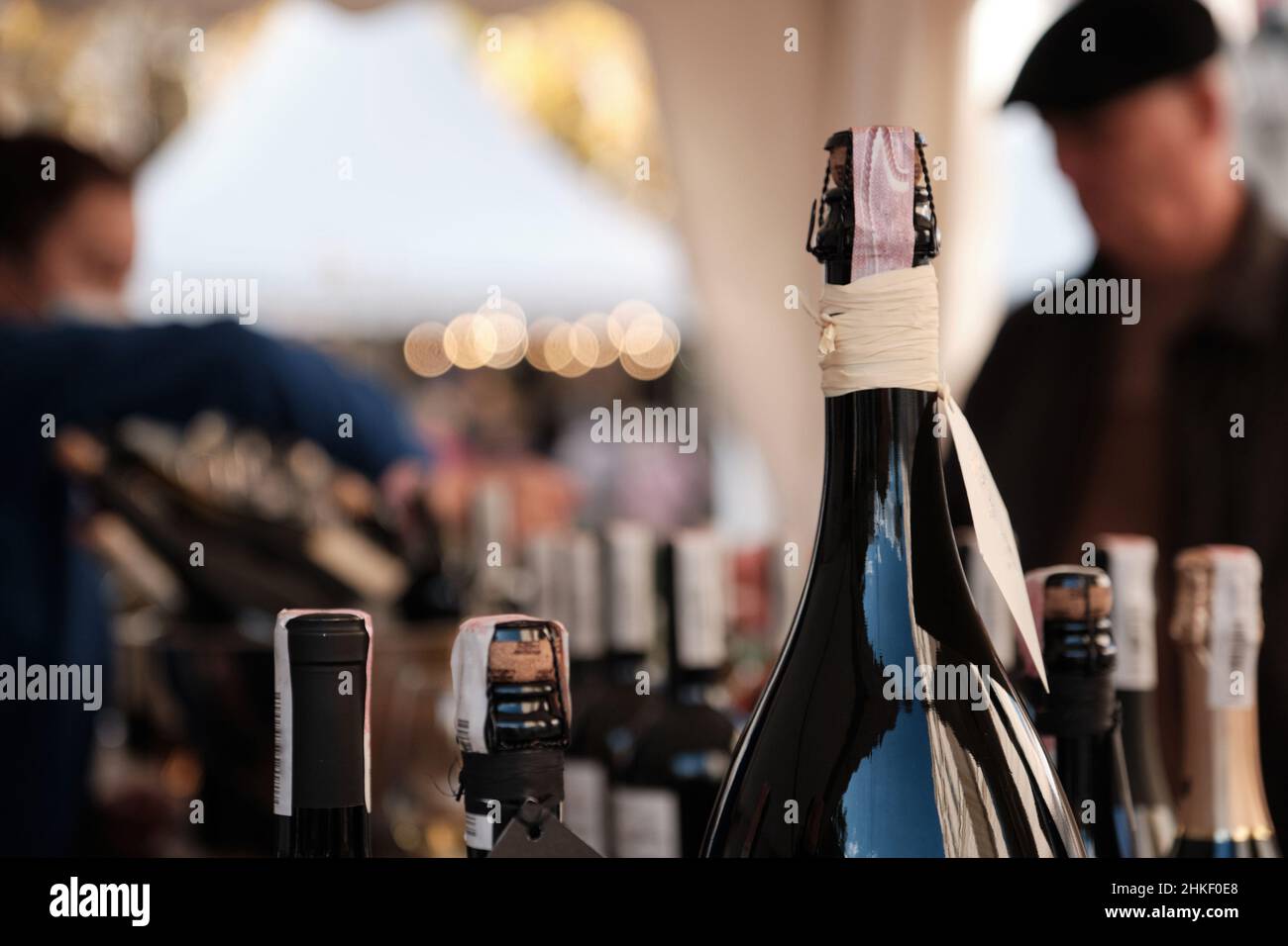 A closeup shot of bottles display at exhibitor stand at food and wine fair. Stock Photo
