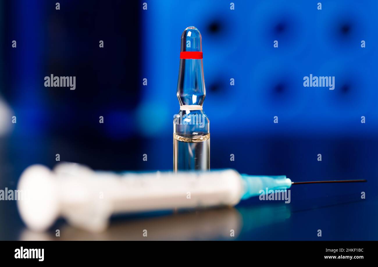 Gene therapy   genetic modification of cells to produce a therapeutic effect. ampoules with drug for gene therapy Stock Photo