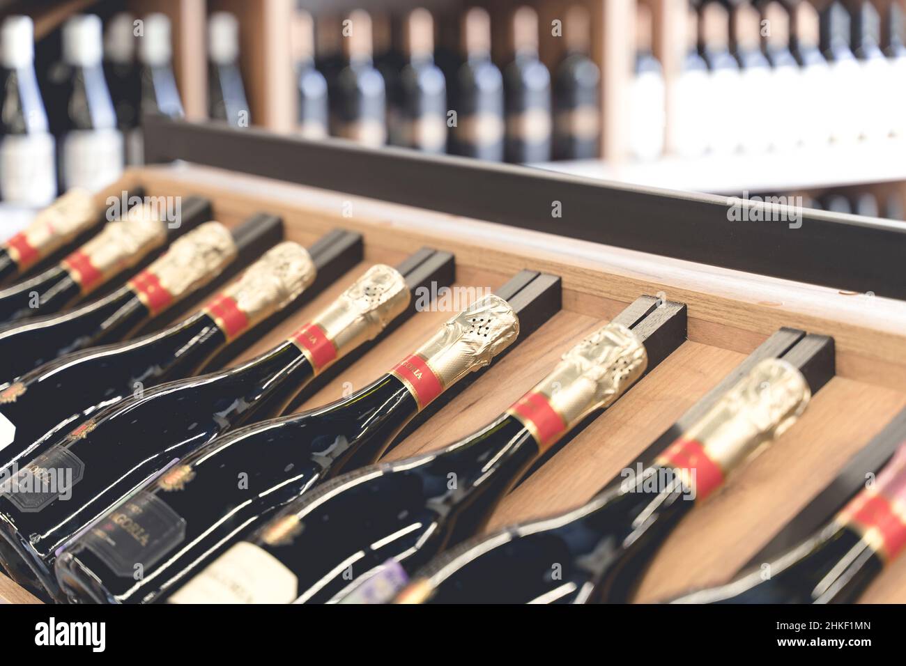 New York, USA - 31 January 2022: Wine bottles on the counter of a liquor store. Wine background. High quality illustration Stock Photo