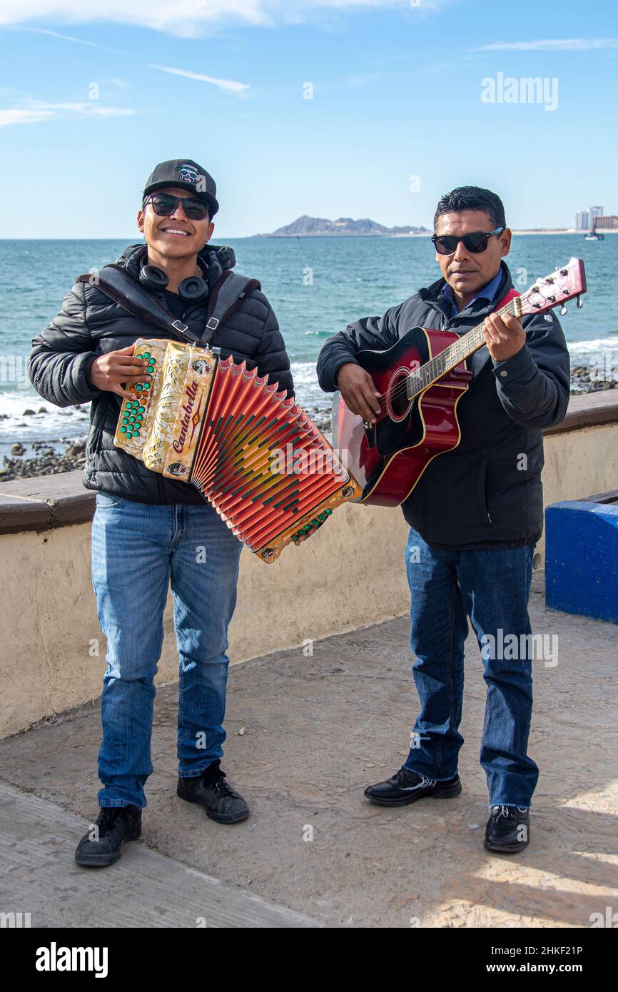 Two musicians strolling along the Malecon in the port city of Puerto Penasco, Baja California, Mexico Stock Photo