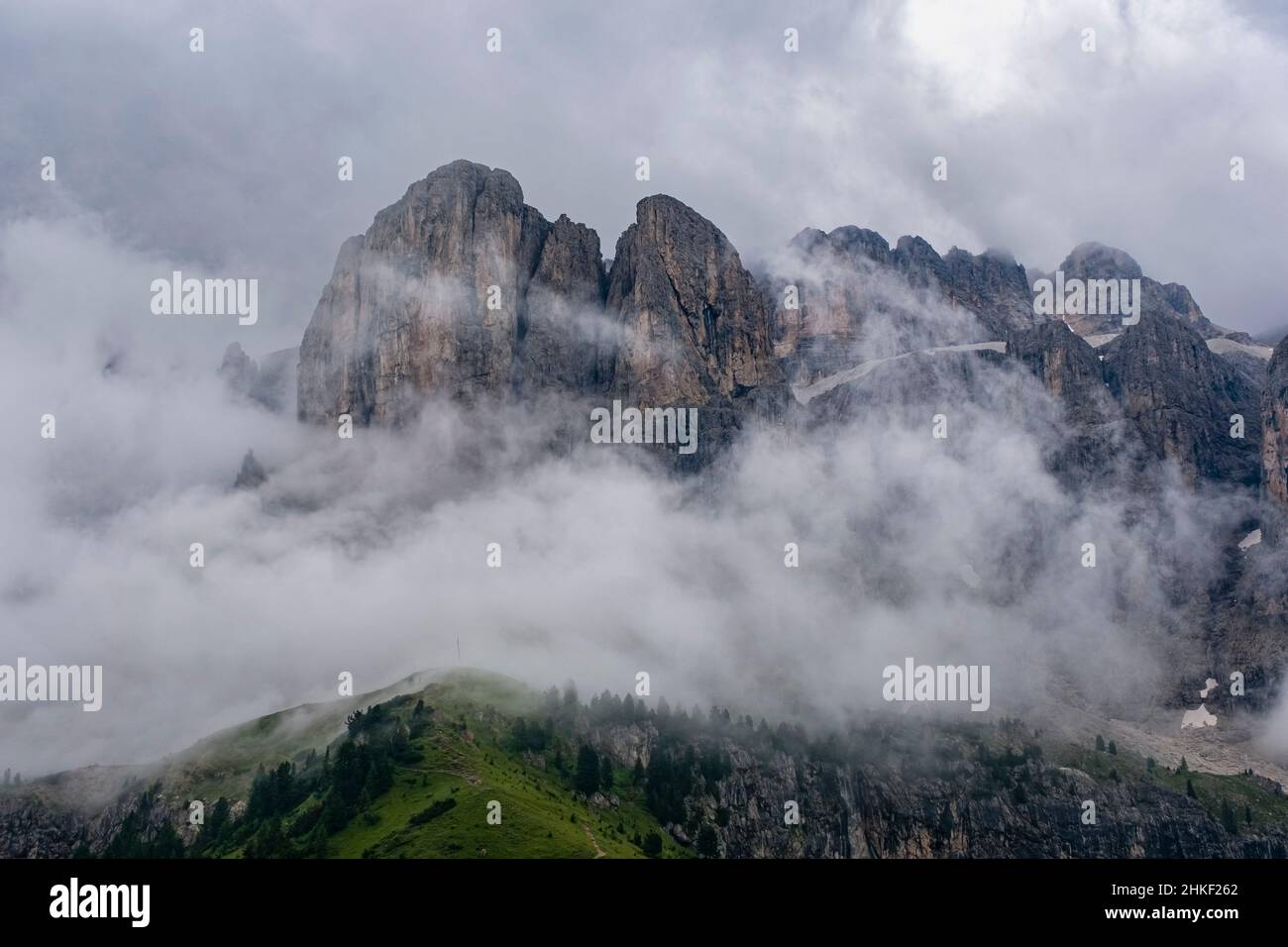 View of the Sella group with the summit of Sas dla Luesa, covered in clouds, seen from the summit of Grand Cir. Stock Photo