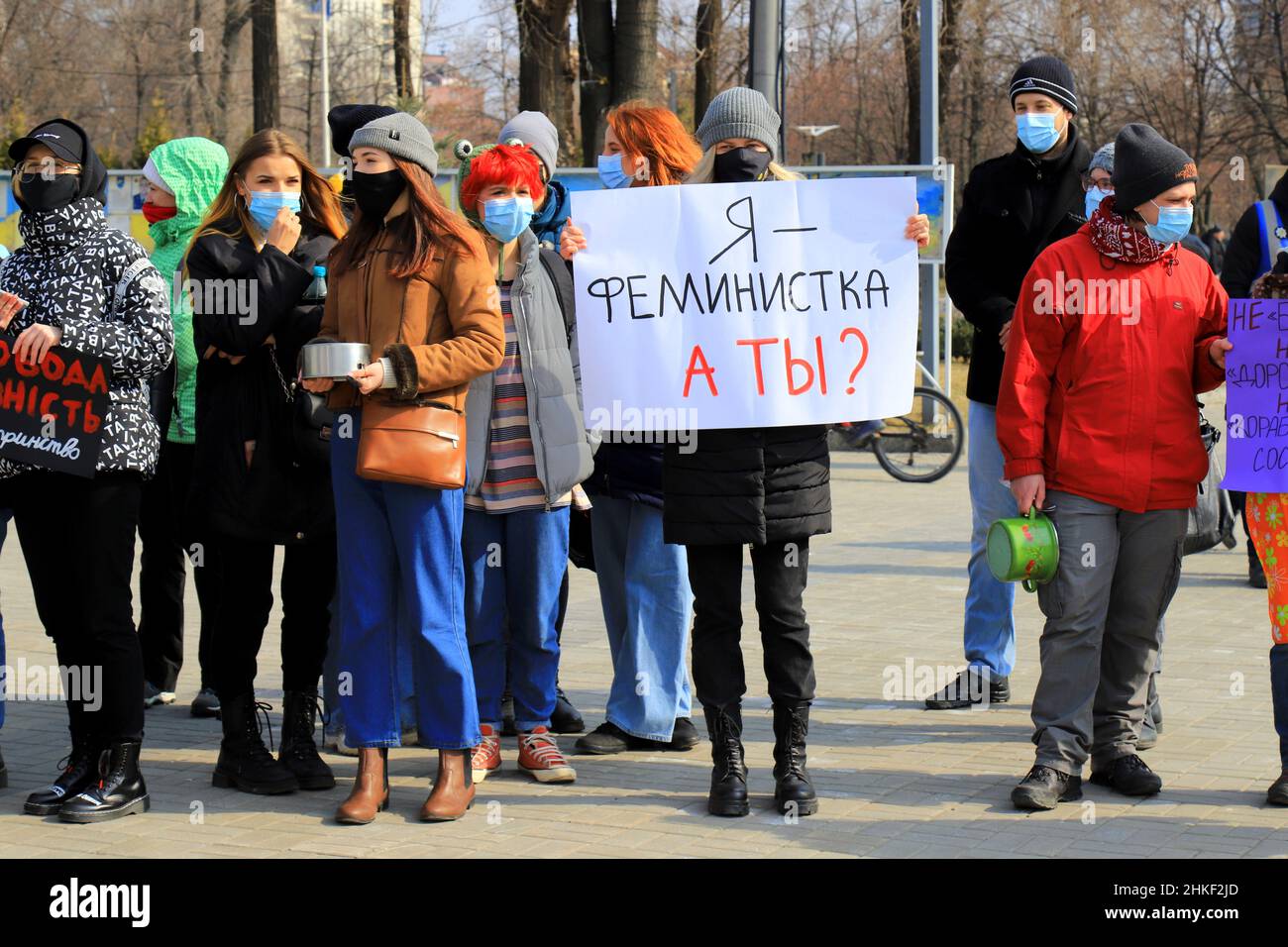 A girl holds poster in Russian - I am feminist, and you Rally for women s rights on International Women s Day March 8, feminism on street. Dnipro city Stock Photo
