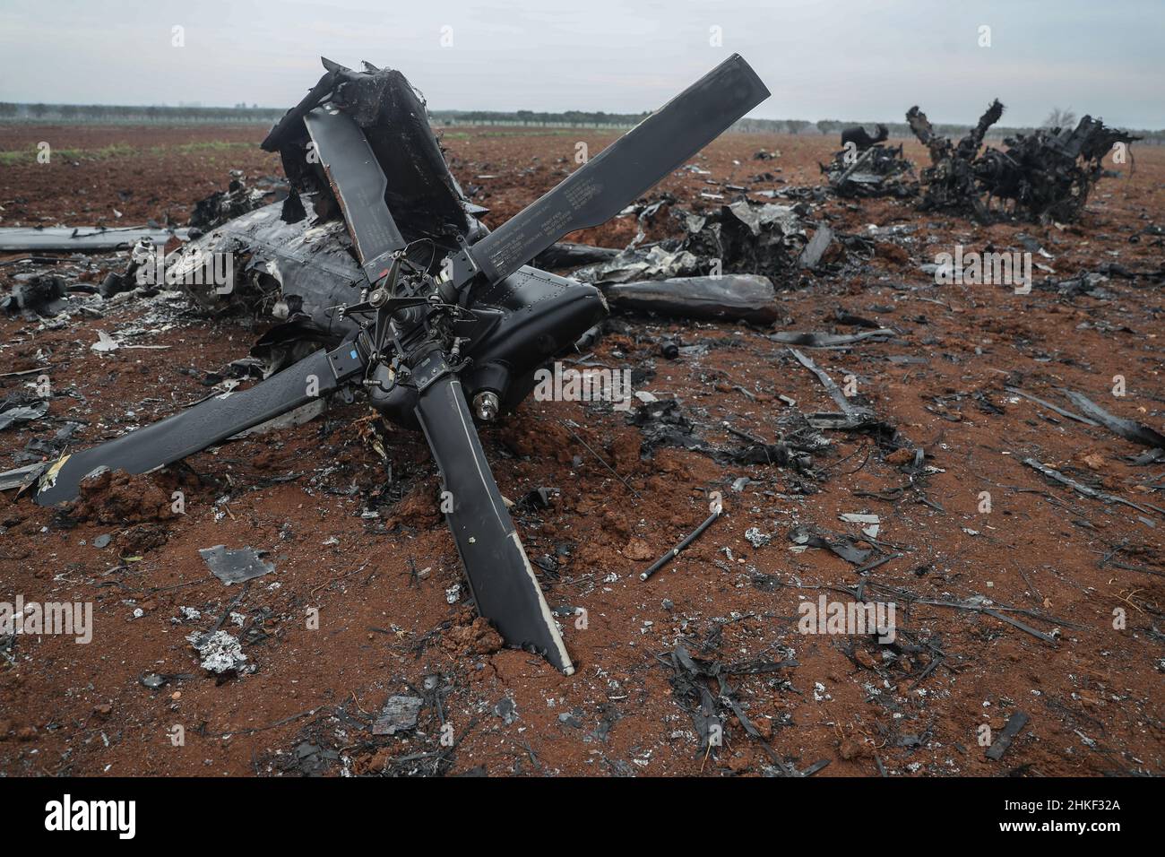 Afrin, Syria. 04th Feb, 2022. Wreckage of an American helicopter that was blown up by the US special forces after facing mechanical issues and was no longer operational. The MH-60 Black Hawk chopper took part in a raid in the town of Atmeh that resulted in the death of ISIS leader Abu Ibrahim al-Hashimi al-Qurayshi. American officials deny it crashed or was shot down. Credit: Anas Alkharboutli/dpa/Alamy Live News Stock Photo