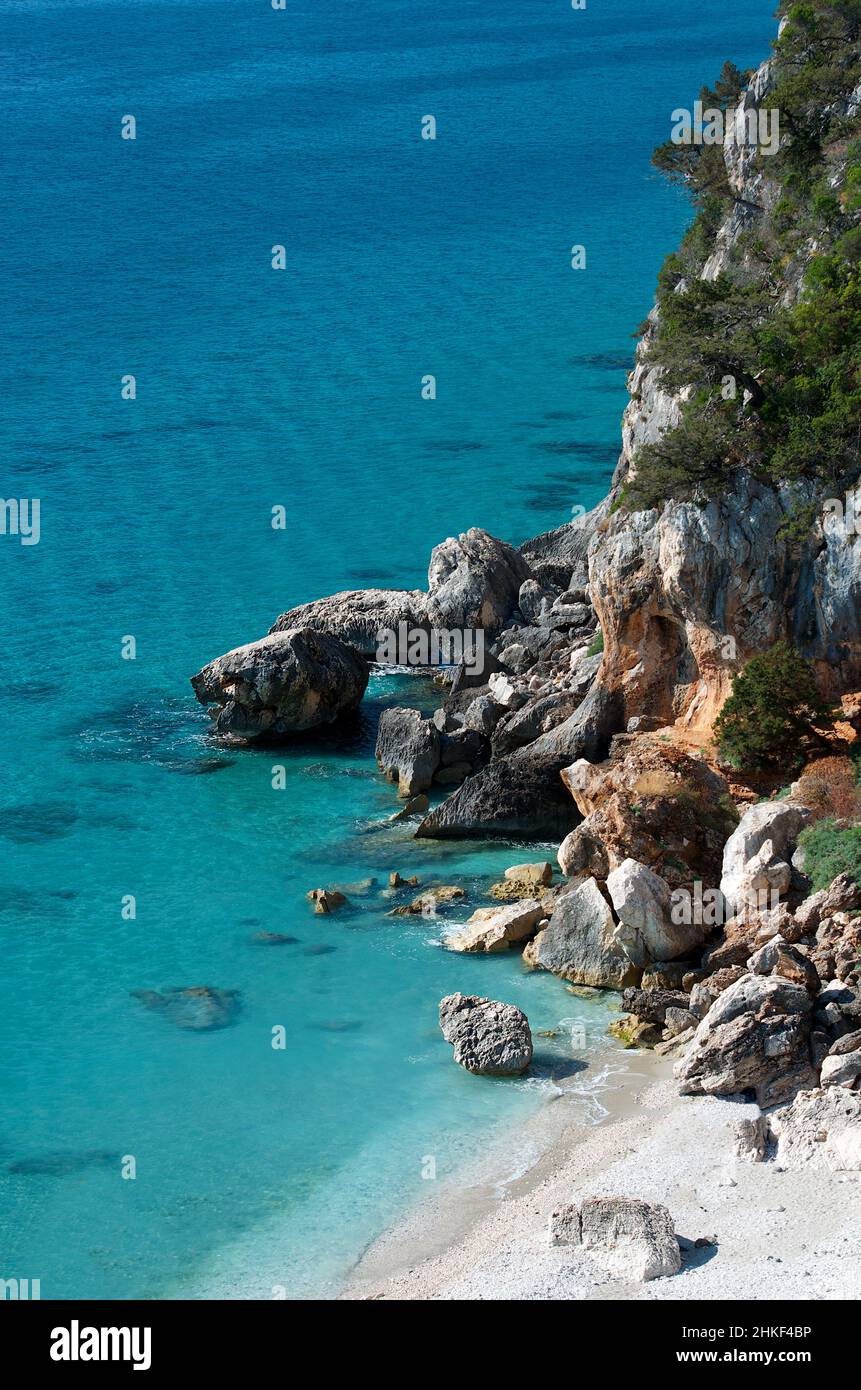 View down to the emerald crystal water sea in Sardinia, coastline view Stock Photo